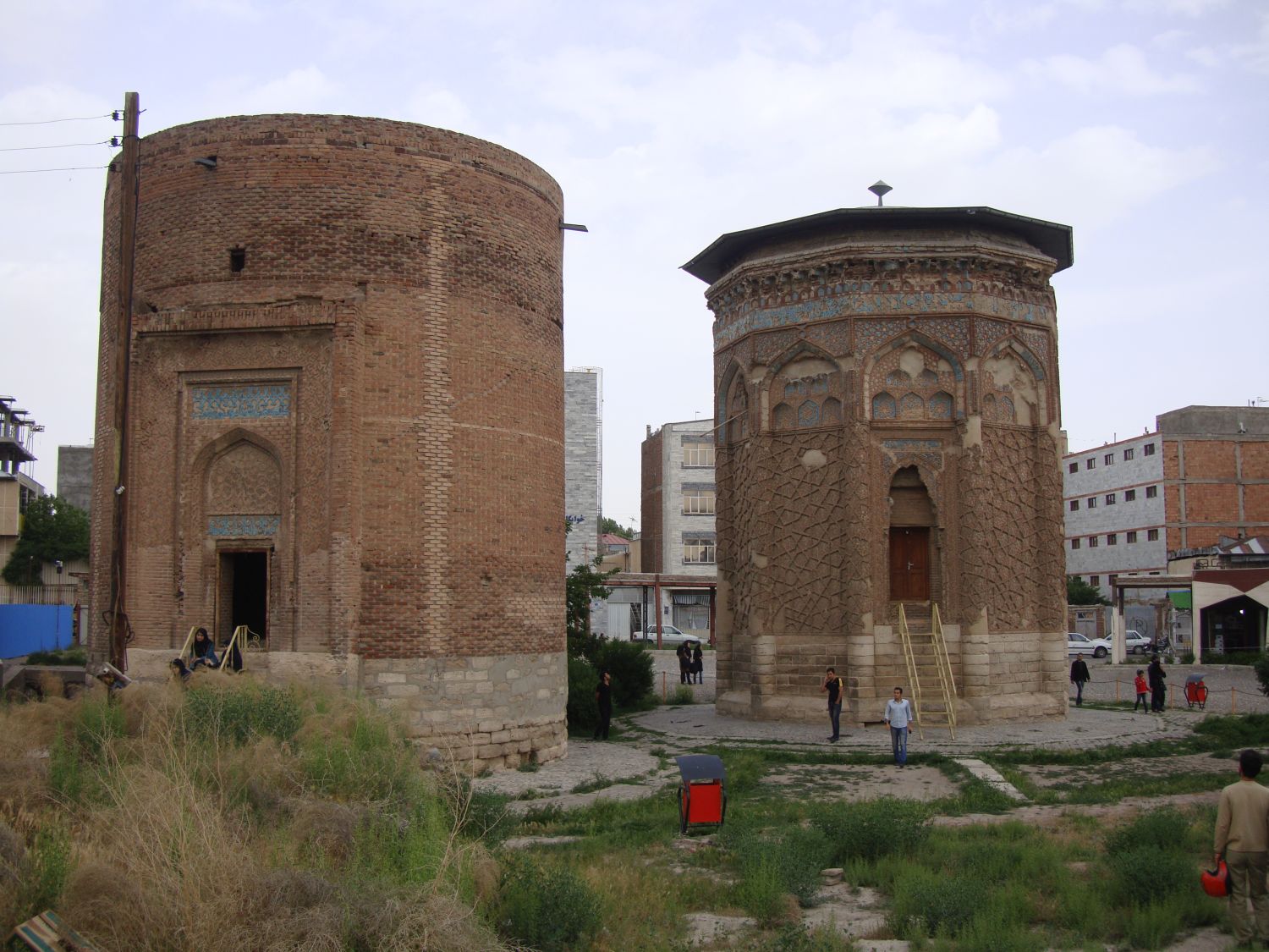 Exterior view of the entrances to the adjacent tombs, with surrounding buildings visible