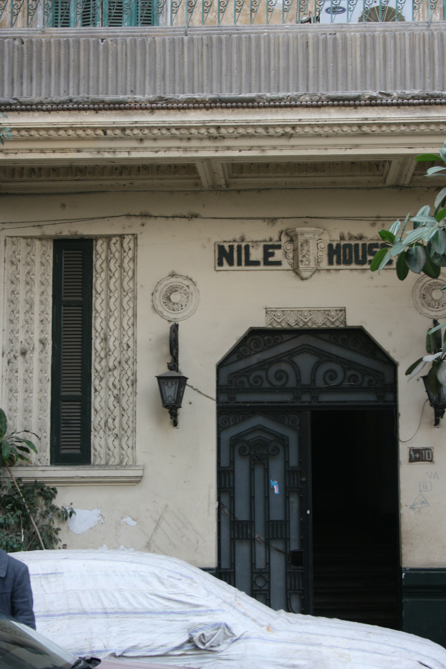 View of the main entrance with wrought iron door and stucco decoration