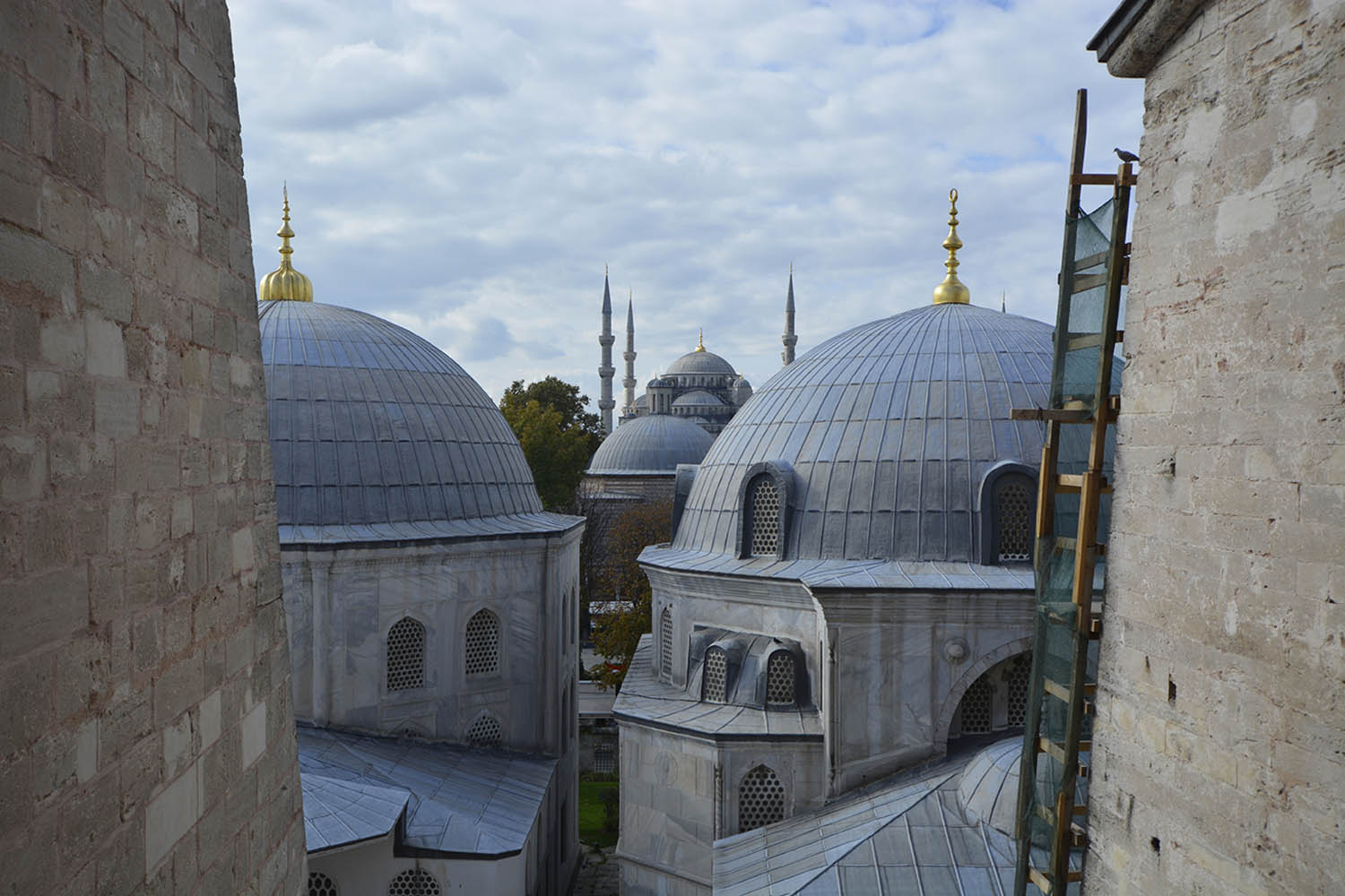 View of the Sultanahmet Camii from the upper floor of Aya Sofya, overlooking the latter's domes and finials.