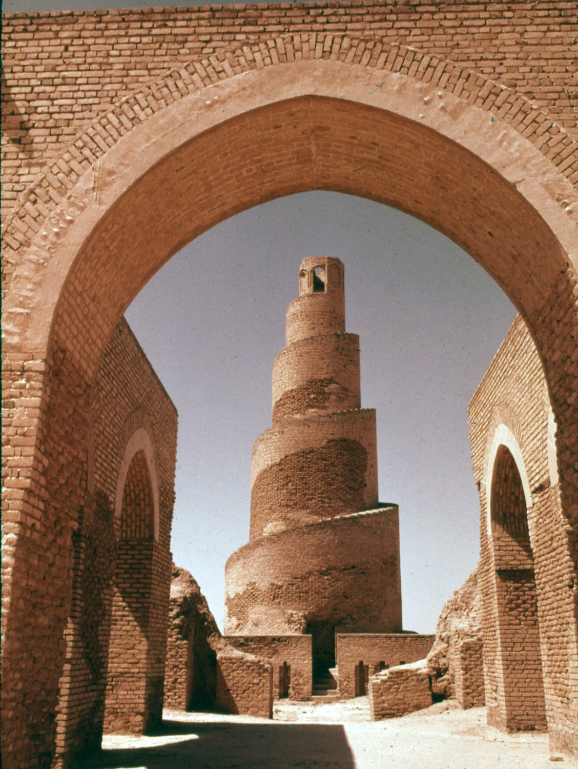 View of spiral minaret from within the mosque arcades, looking north.