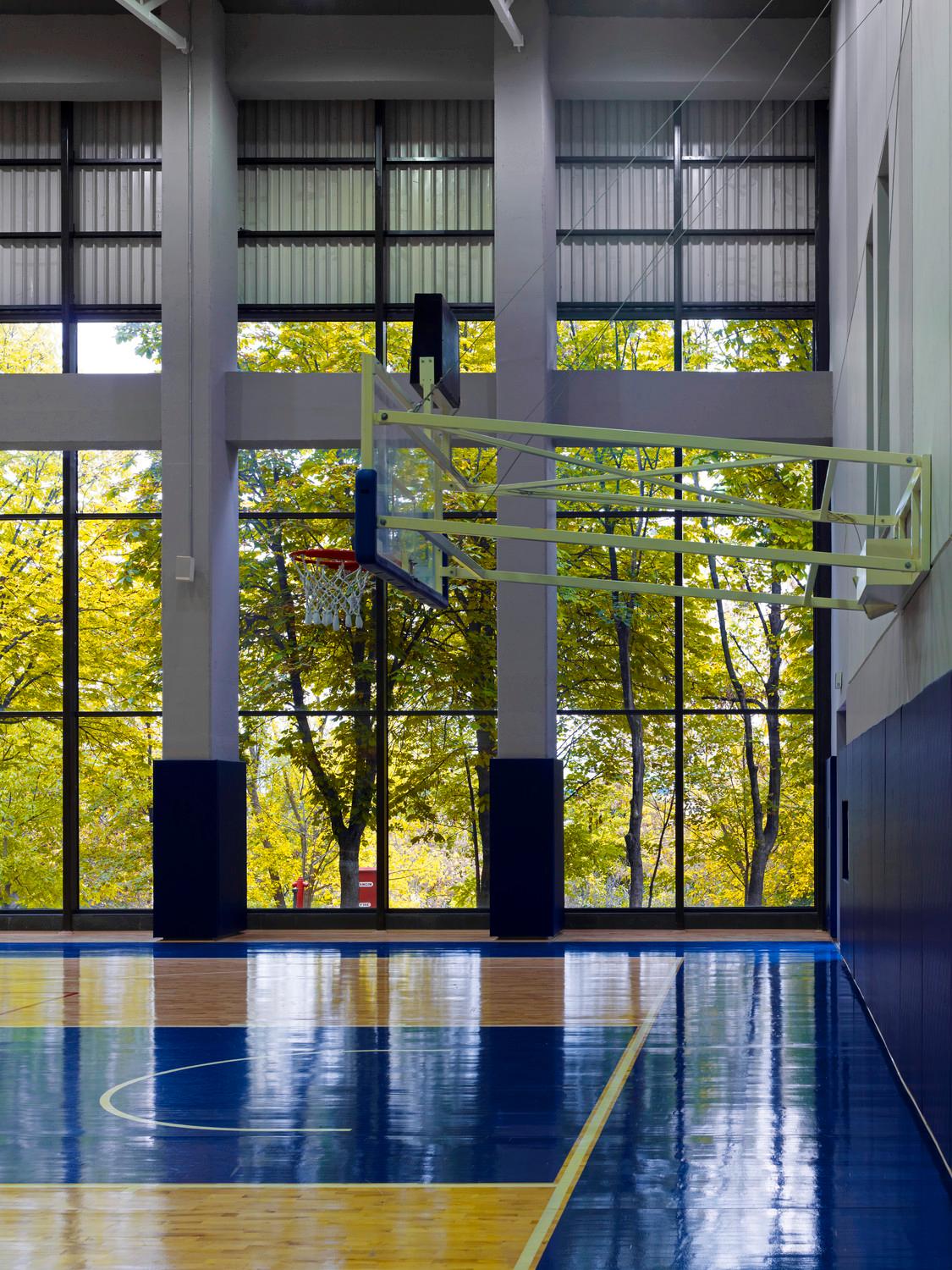 Sports hall interior, full height glazing facing the surrounding landscape