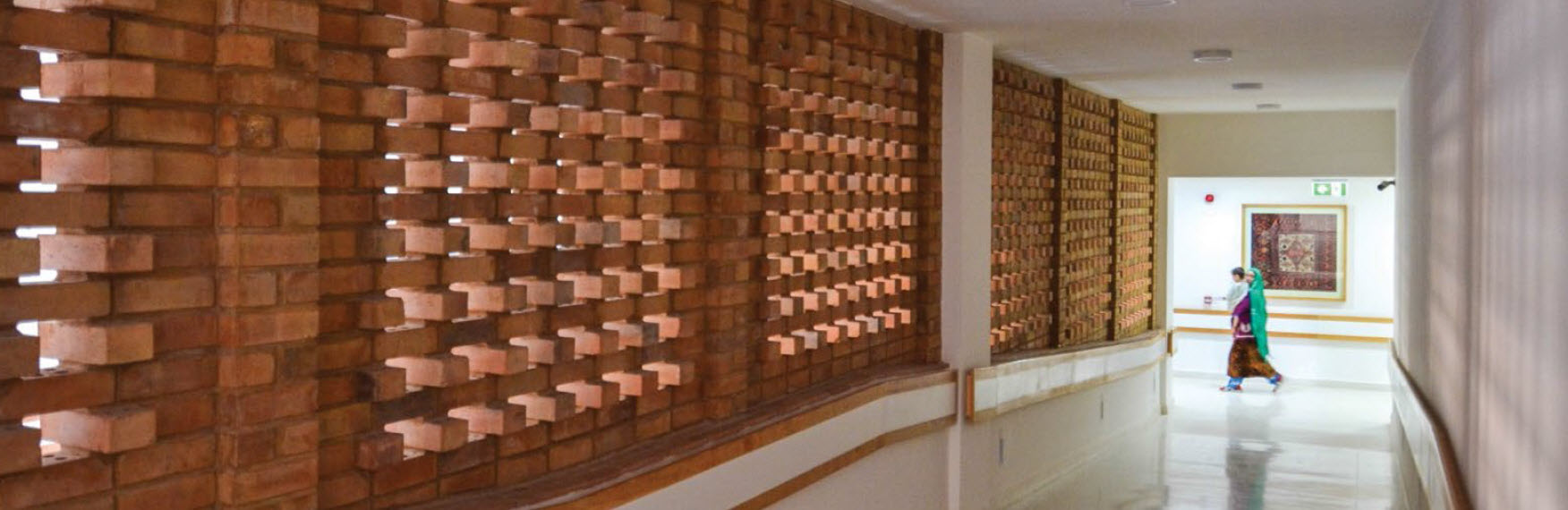 Interior, hallway with brick screen