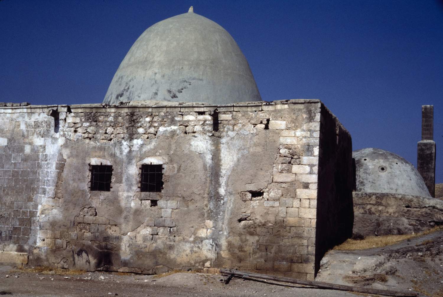Exterior view. The dome of one of the subterranean inner chambers is visible at right.