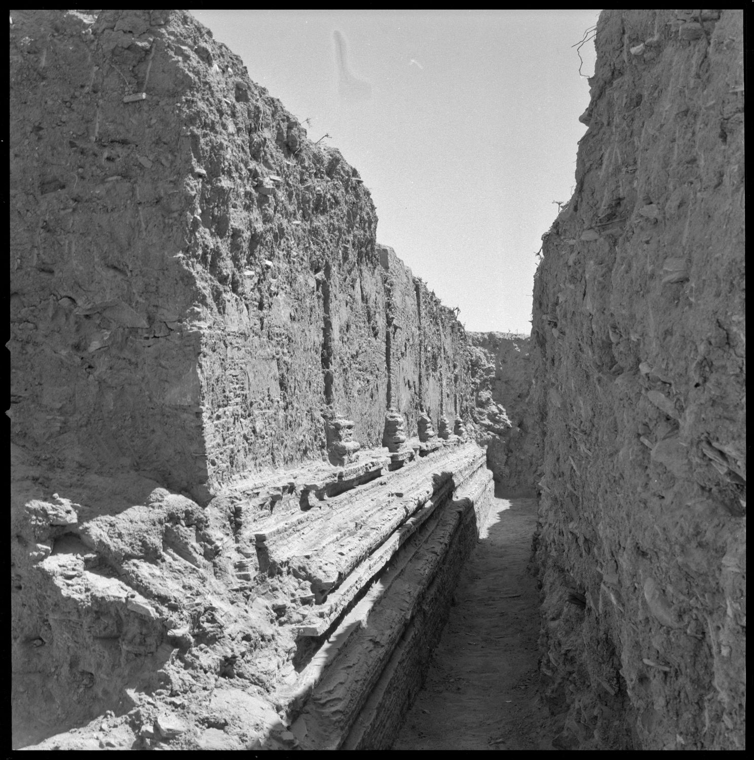 Excavation of main stupa, showing the walls emerging from the trench.