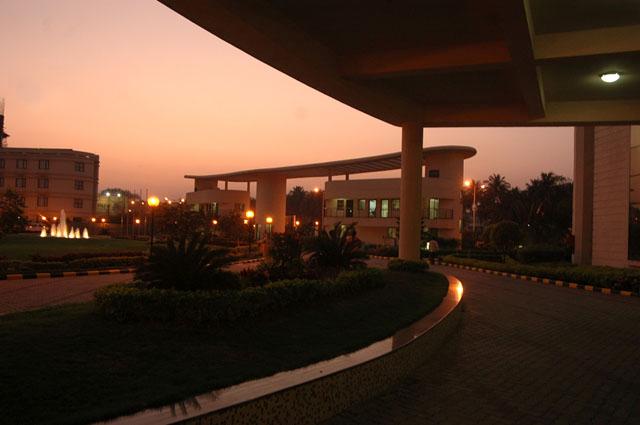 View at dusk from learning centre portico towards gate house