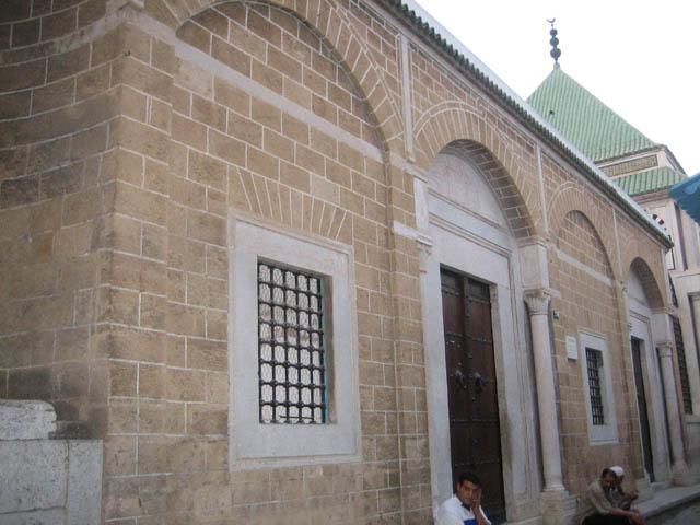 Masjid Hammuda Pasha - Southwestern elevation of exterior mosque wall with roof over tomb space in the background