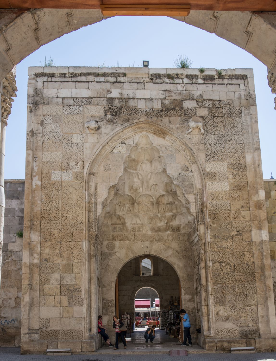 Entrance portal, viewed from within the arched portal of Cifte Minareli Medrese opposite.
