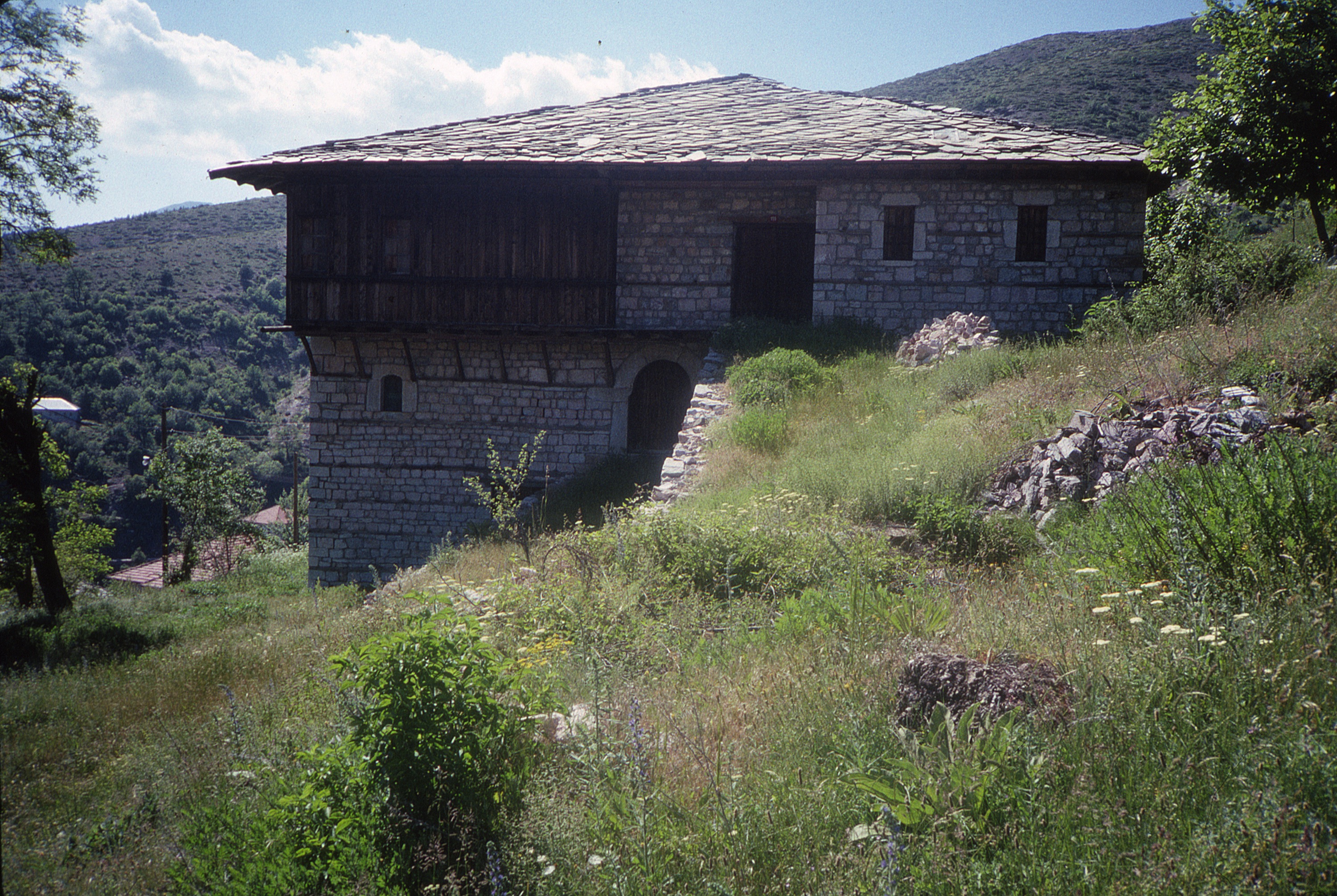 <p>This three storey dwelling previously belonged to the Tomoski family. The roof has the traditional stone panels (ploča) and masonry walls with wooden reinforcing strips. The reinforced masonry is an important element in Macedonia since seismic activity is common. The projecting corner čardak has additional brackets to support this element. The structure has become a house museum.</p>
