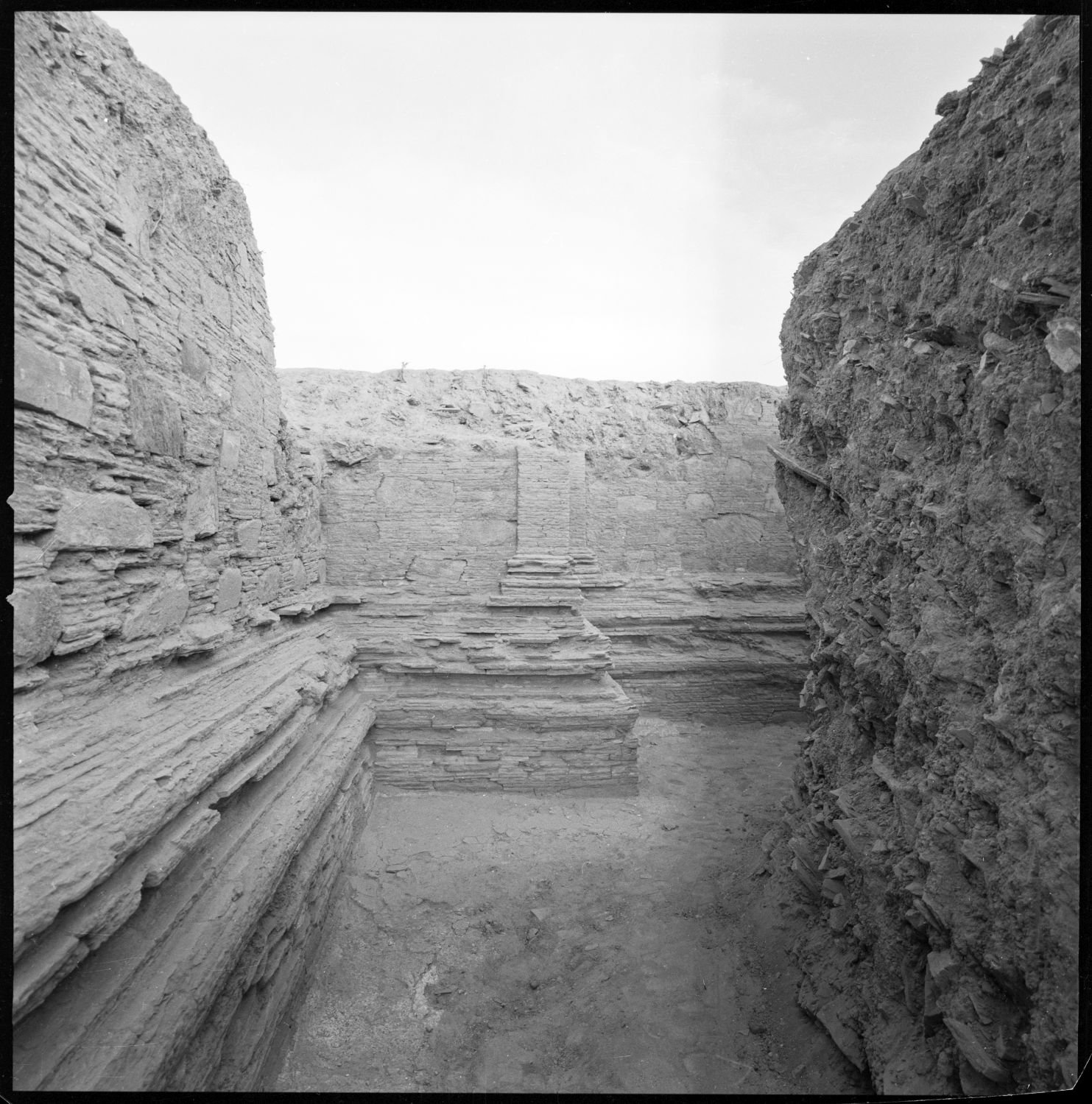 Excavation of walls of stupa.