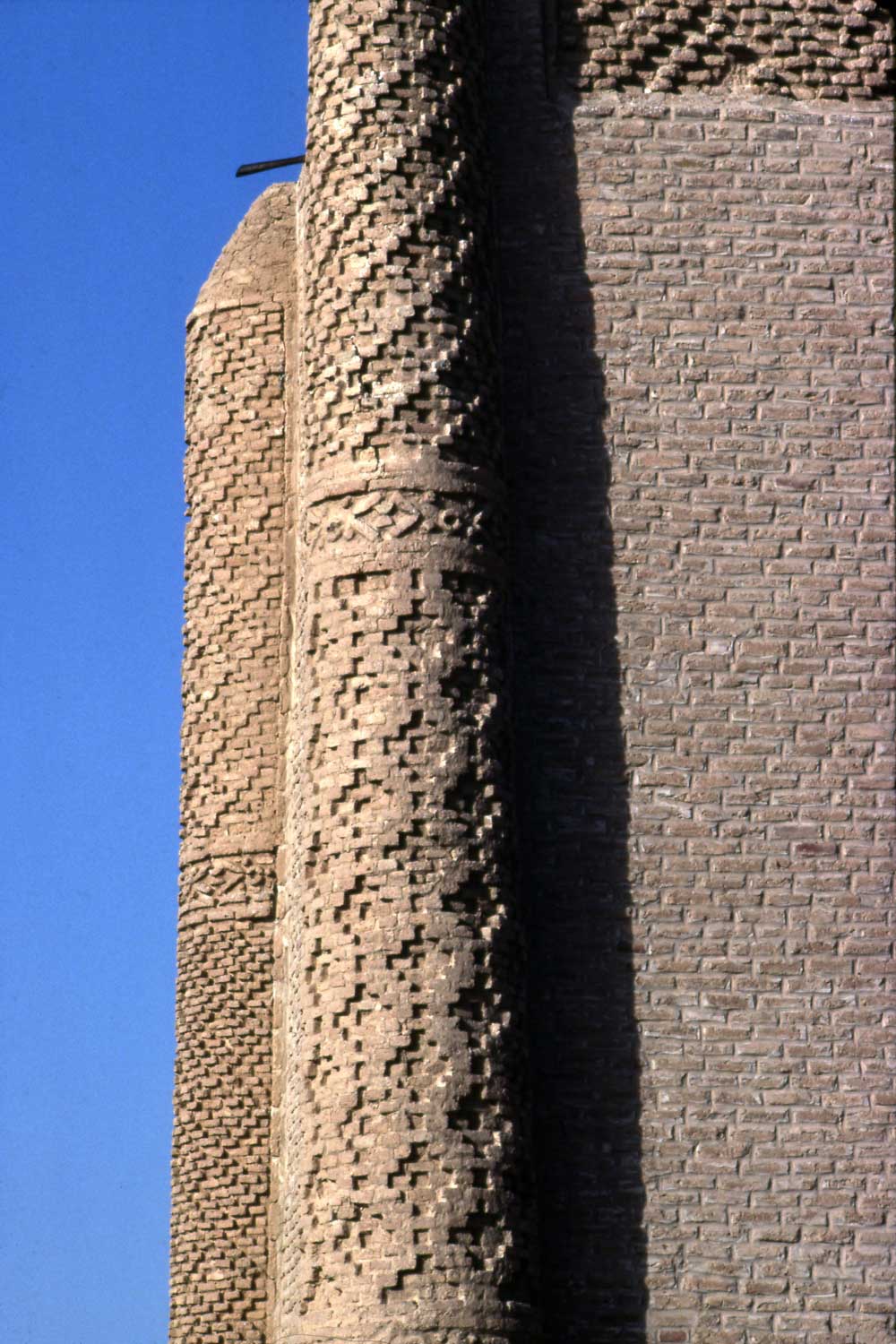 Exterior detail of hazar-baf brickwork on one of the engaged corner towers