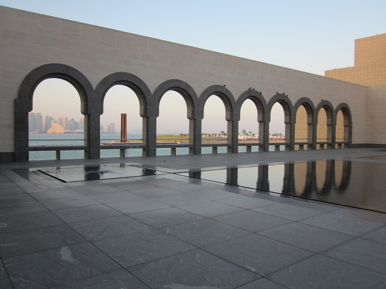 View of park and Richard Serra sculpture from courtyard of the Museum of Islamic Art