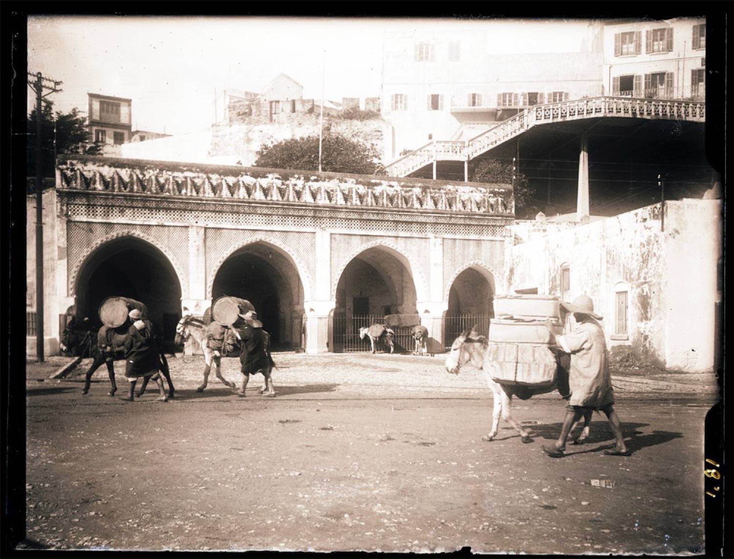 Exterior view, donkeys bringing goods to the Customs House