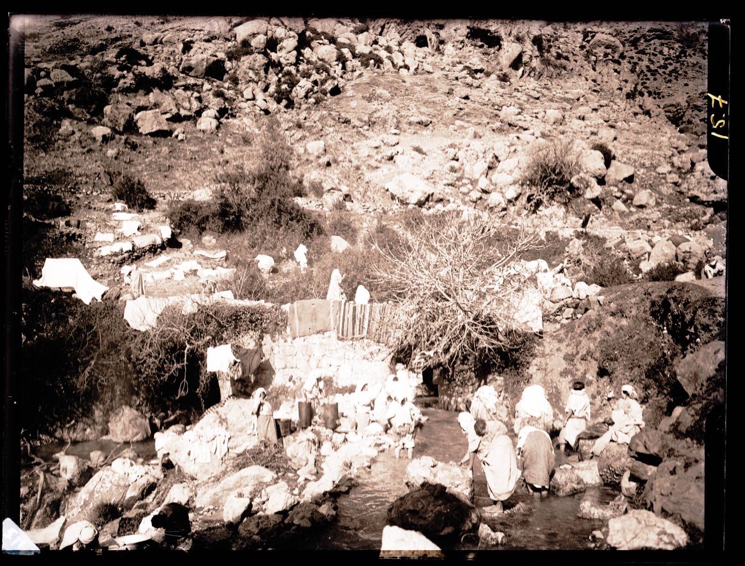 View of women doing laundry in a stream on the road to Chefchaouen