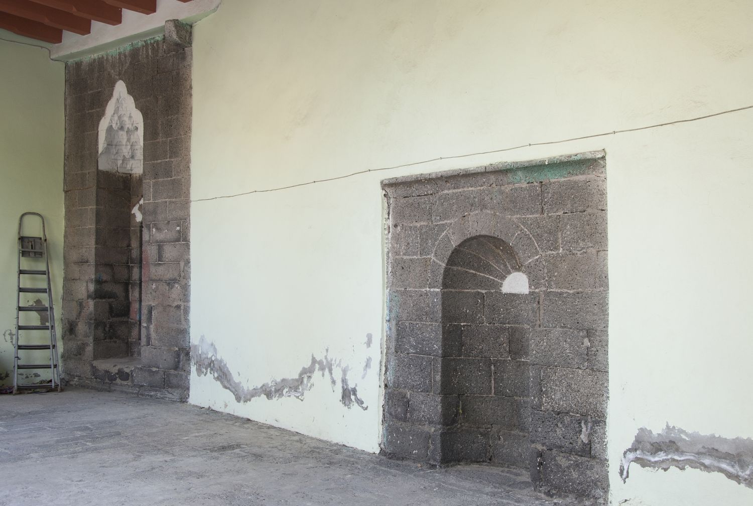 Mihrabs under portico on south side of courtyard.