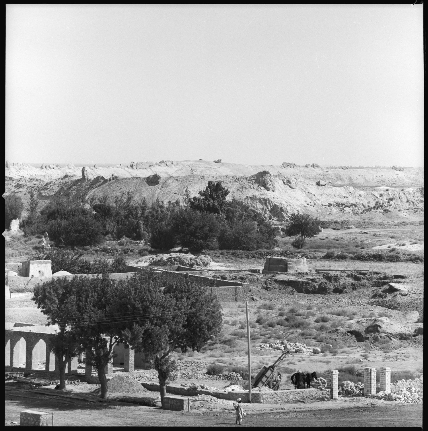 Distant view showing walls.