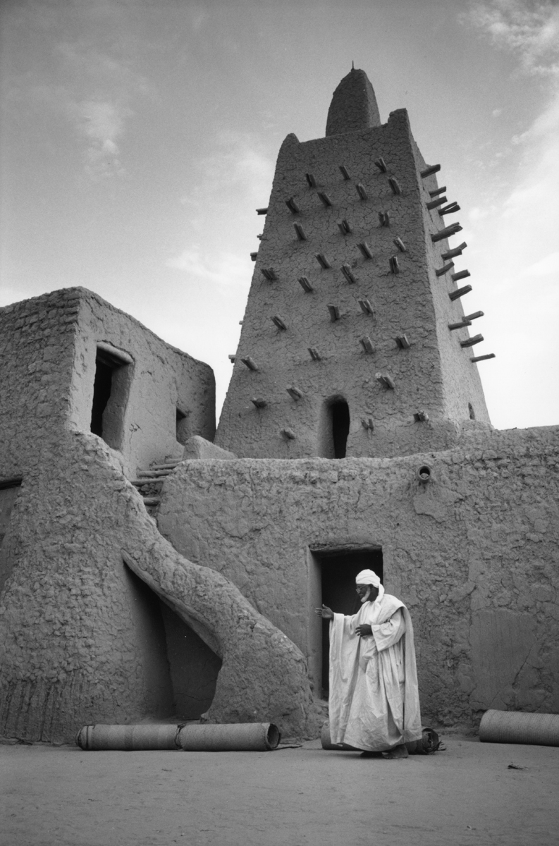 <p>Imam next to the stairs leading to the minaret</p>