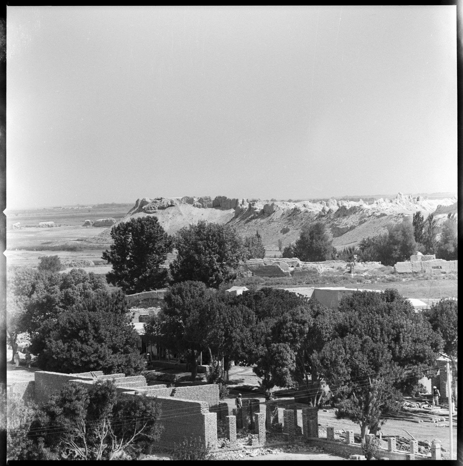 Distant view showing walls.