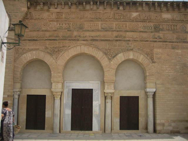View of slightly pointed horseshoe arches of the three doors