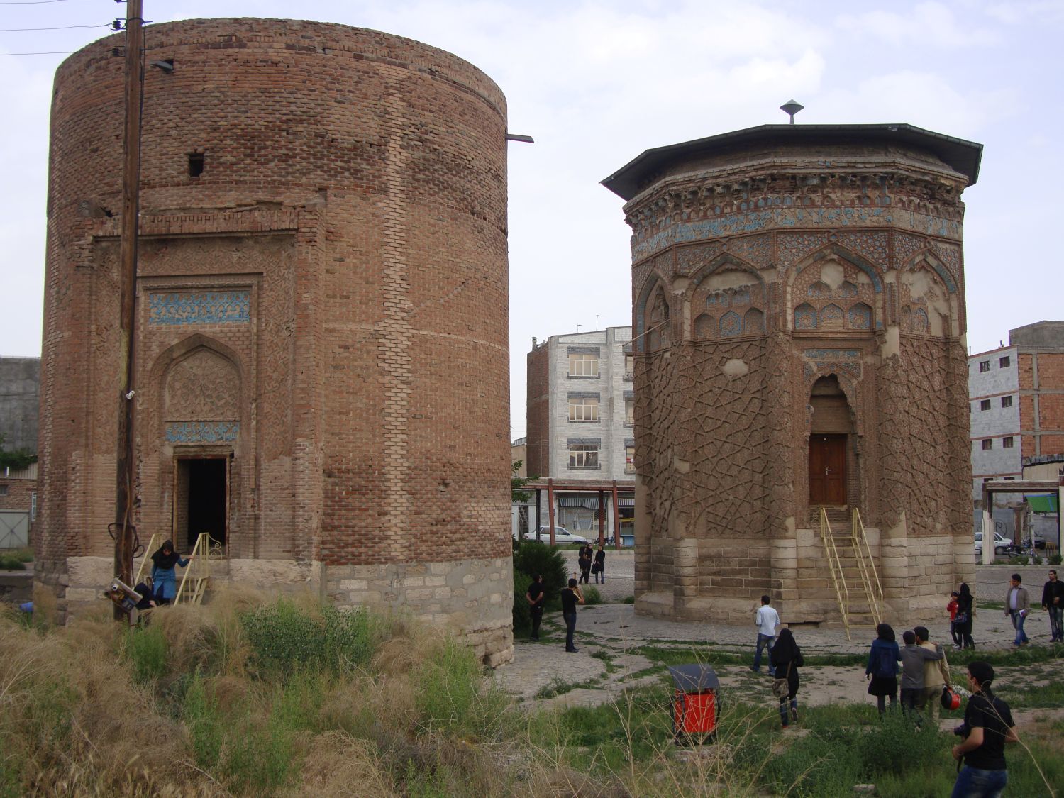 Exterior view, portal facades of adjacent tombs, the round tomb tower and Gunbad-i Qabud