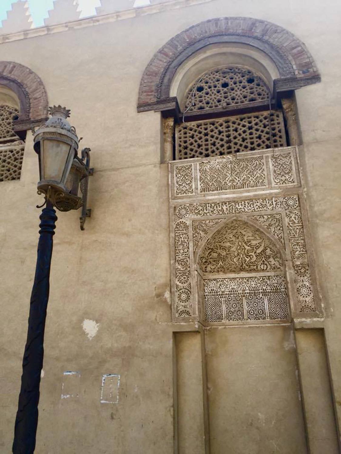 Jami' 'Amr ibn al-'As - Detail view of a niche in the exterior façade, with calligrpahic and floral decoration, and window screen 