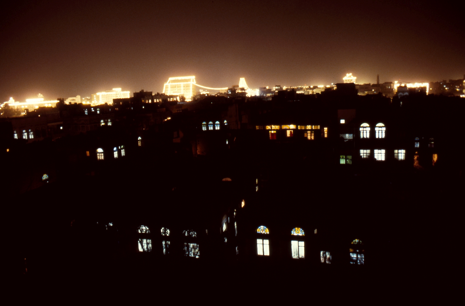 Sana'a. General views. View of city celebration during a national holiday, with buildings illuminated. 