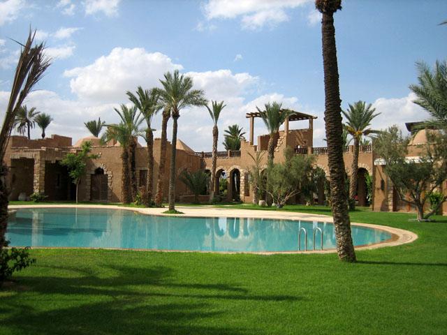 View towards the link between main house and guest house north west from the pool, Marzouka villa