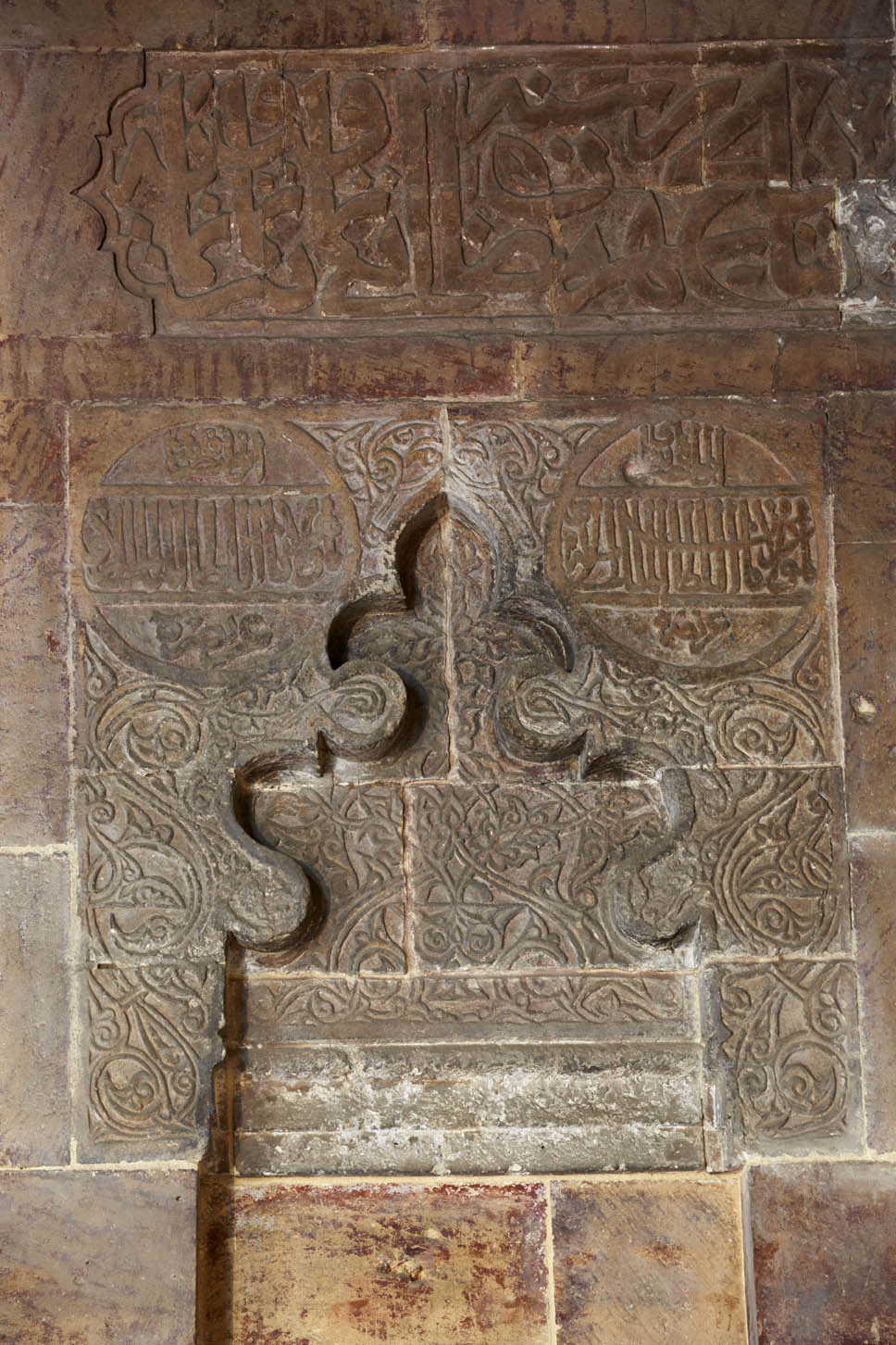 Detail of carved ornament and inscriptions