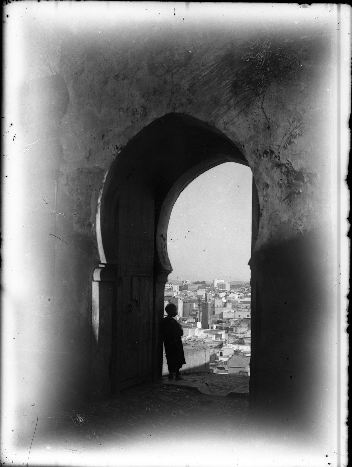 <p>View of a figure standing in Bab al-Assa</p>