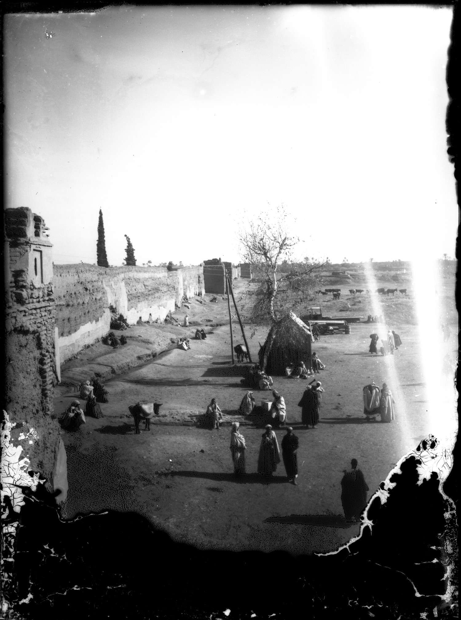 View looking down from the gate of Bab Ghmat, with people gathering and walking.
