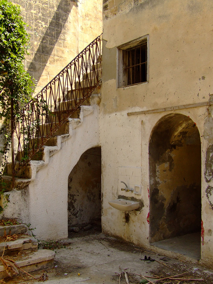 Main entrance (Dihleez) and the bathroom under one of the stairs before restoration  