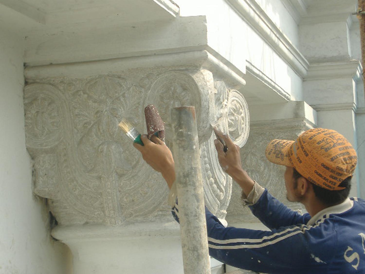 Conservation and repair of the relief on the column capital. It shown the (No Suggestions) ornaments puts on the neo-classical column. The relief already layered by thick painting, and the painting should be removed to make the relief “crispy”.