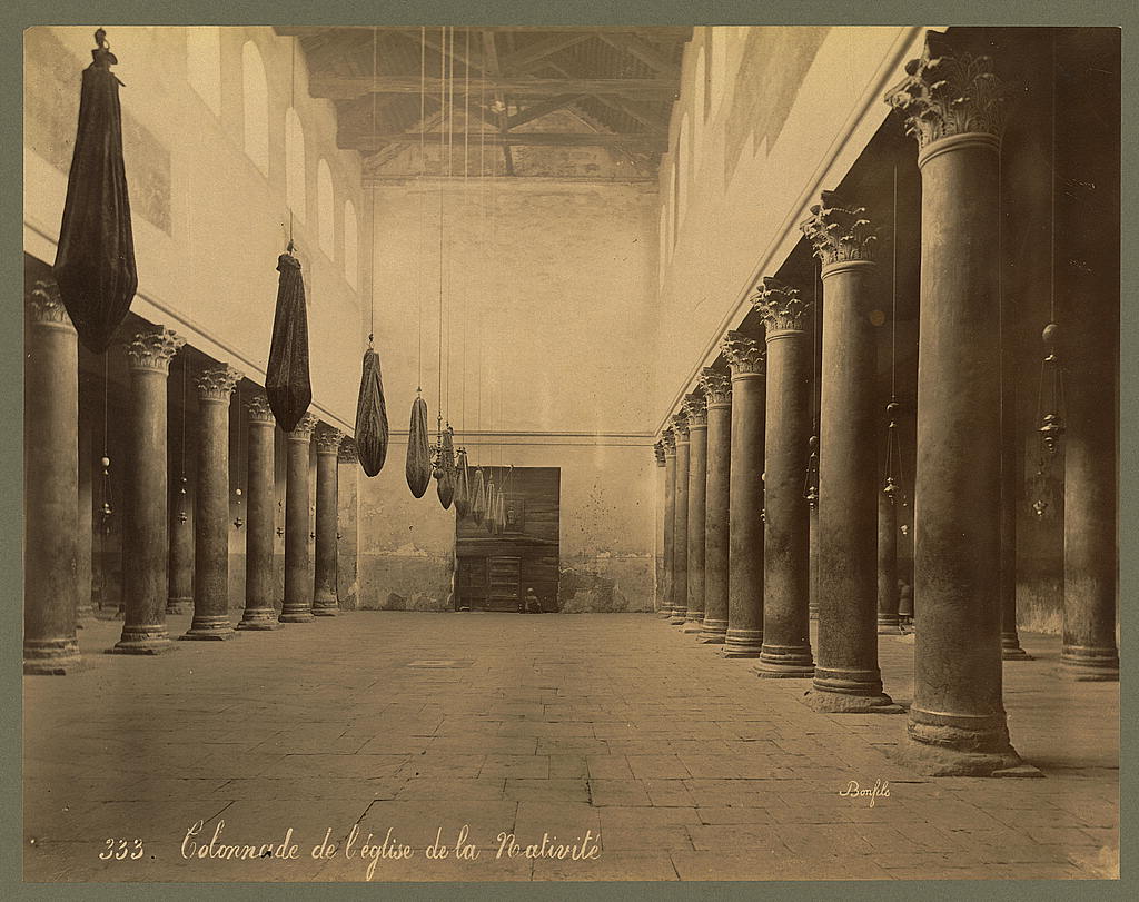 Church of the Nativity - <p>Interior view of the colonnade with cloth covered lamps suspended from the ceiling</p>