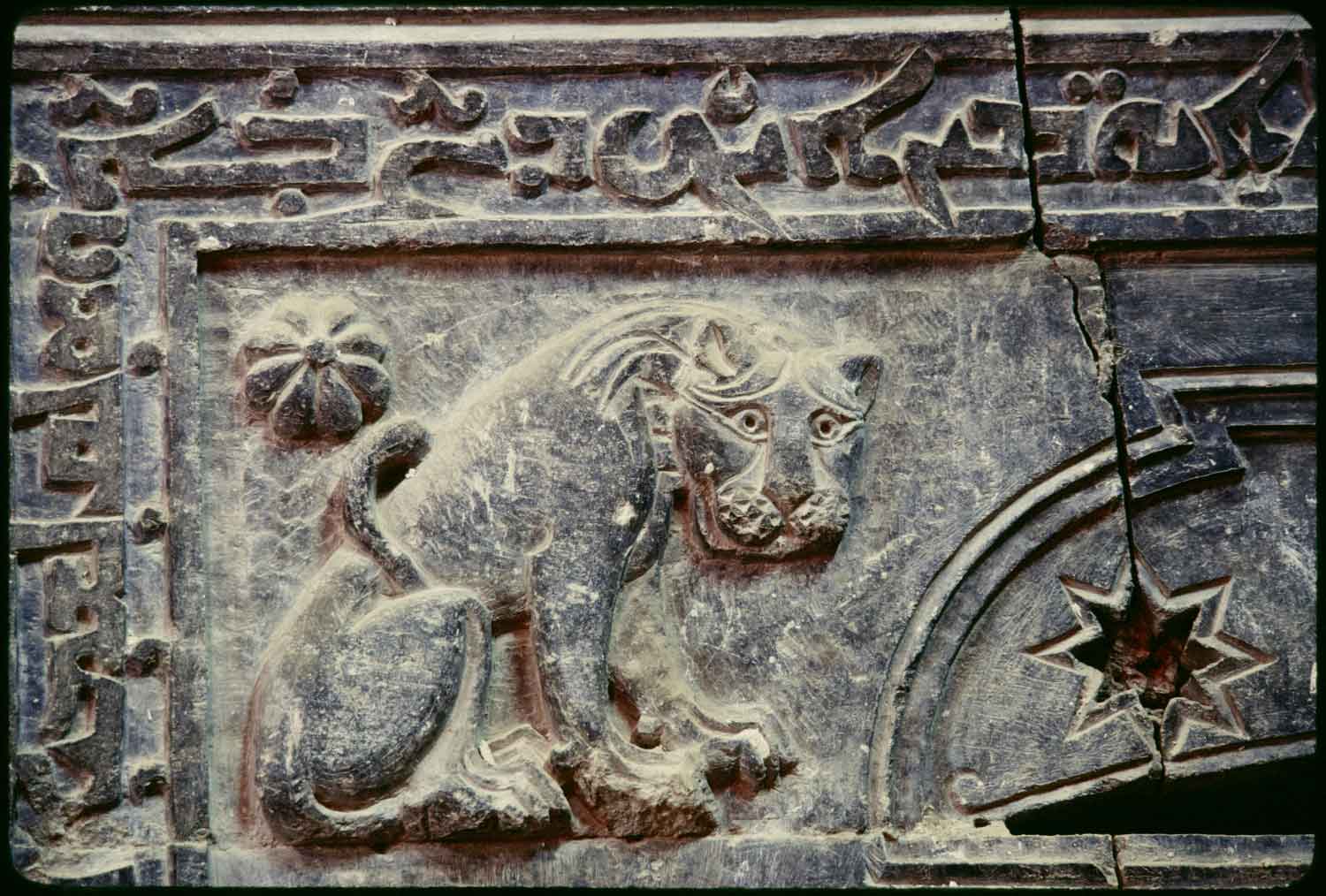 Monastic church, detail of lion carving on the northern exterior gate.