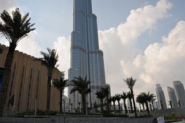 Burj Khalifa's exterior cladding is comprised of reflective glazing with aluminum and textured stainless steel spandrel panels and stainless steel vertical tubular fins, close to 26,000 glass panels, each individually hand-cut