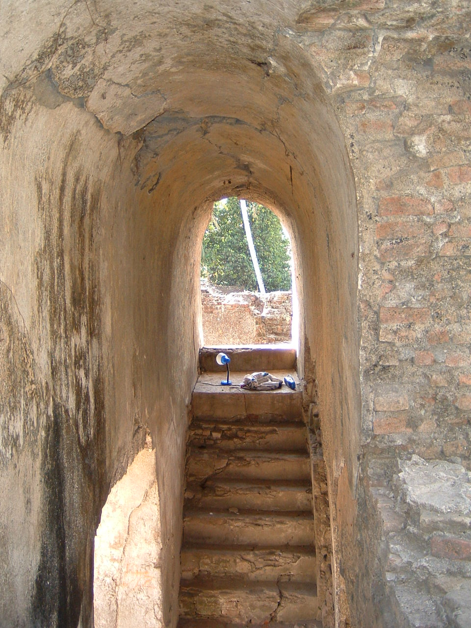 Interior view looking north at southern internal stairway that leads to second level