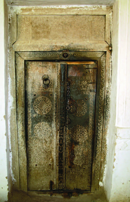 Carved timber doors to the ziarat