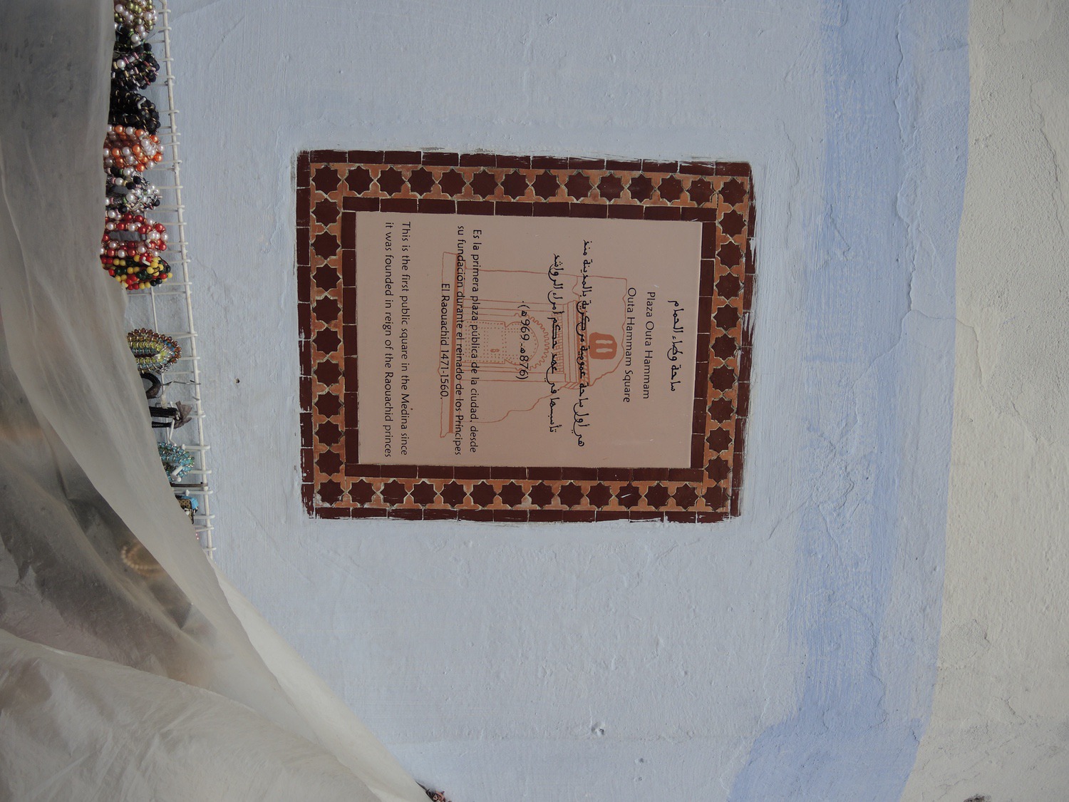 View of an tile with information on the monument attached to the wall