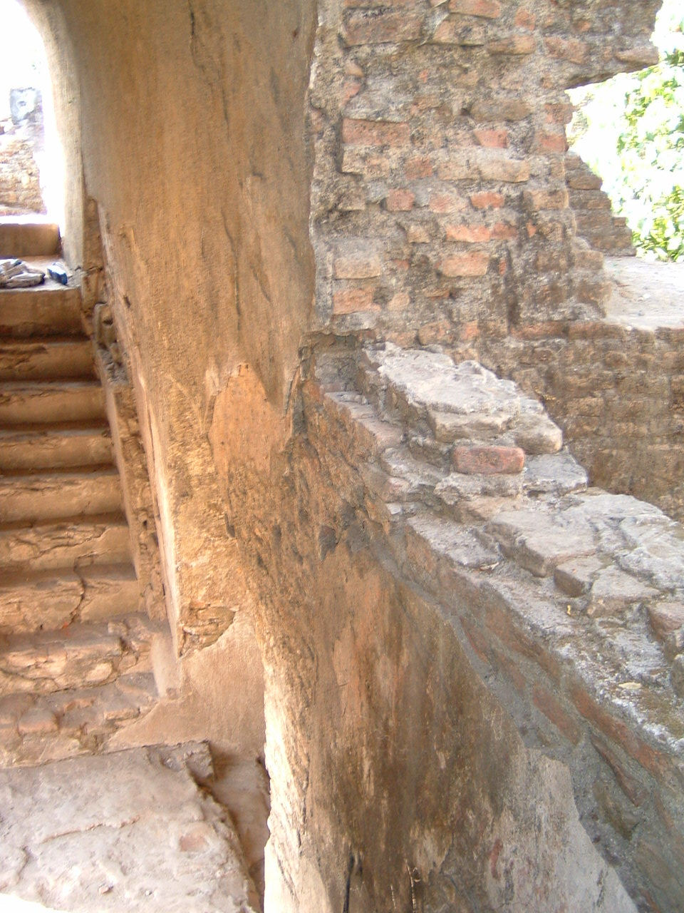 Detail view of southern stairway. Below, a blocked arch