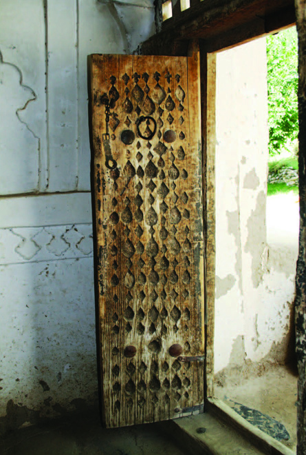 Carved timber door to the main vestibule