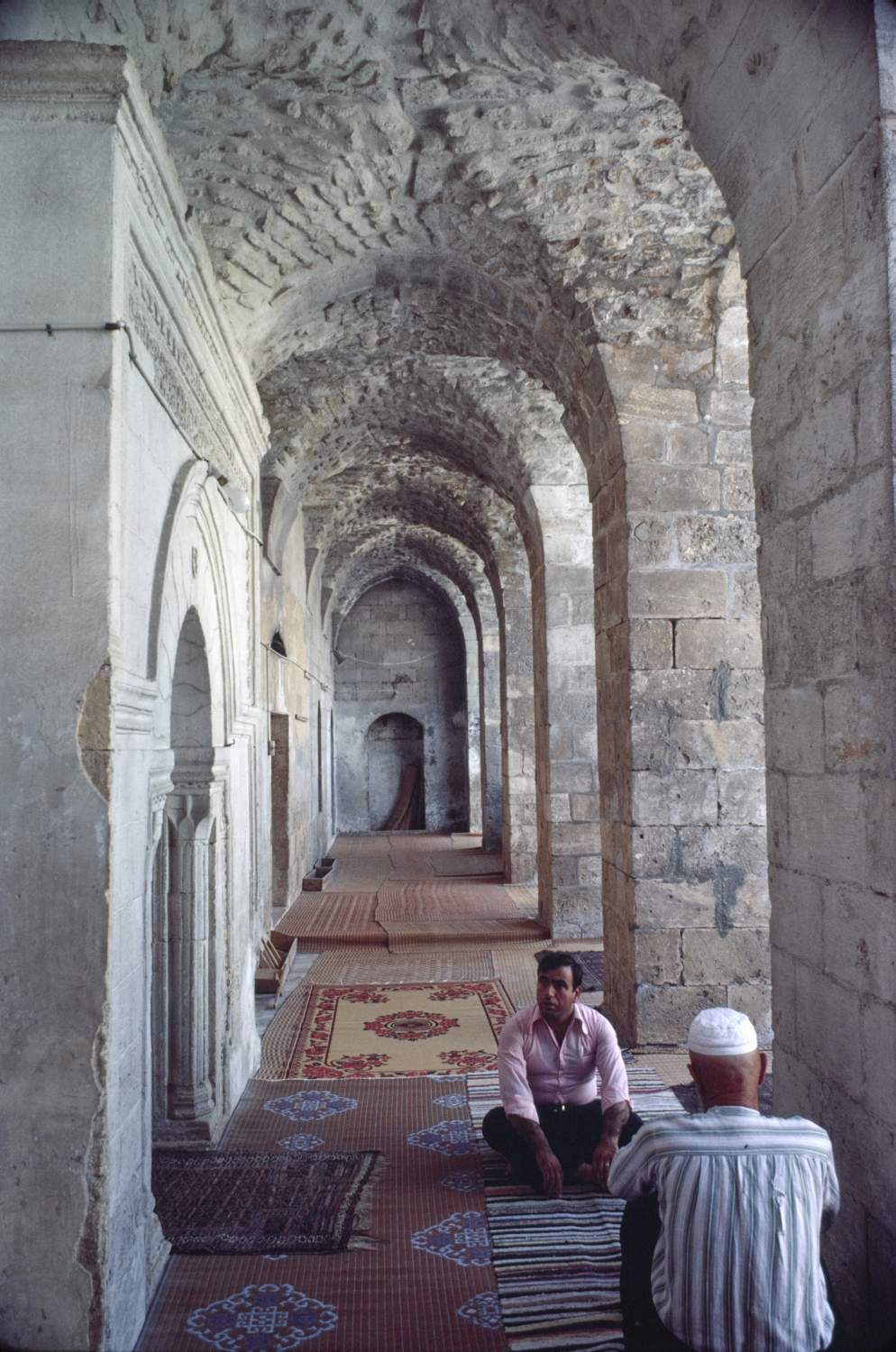 Maqam Ibrahim (Salihin) - View down arcade on qibla side of courtyard before mihrab.