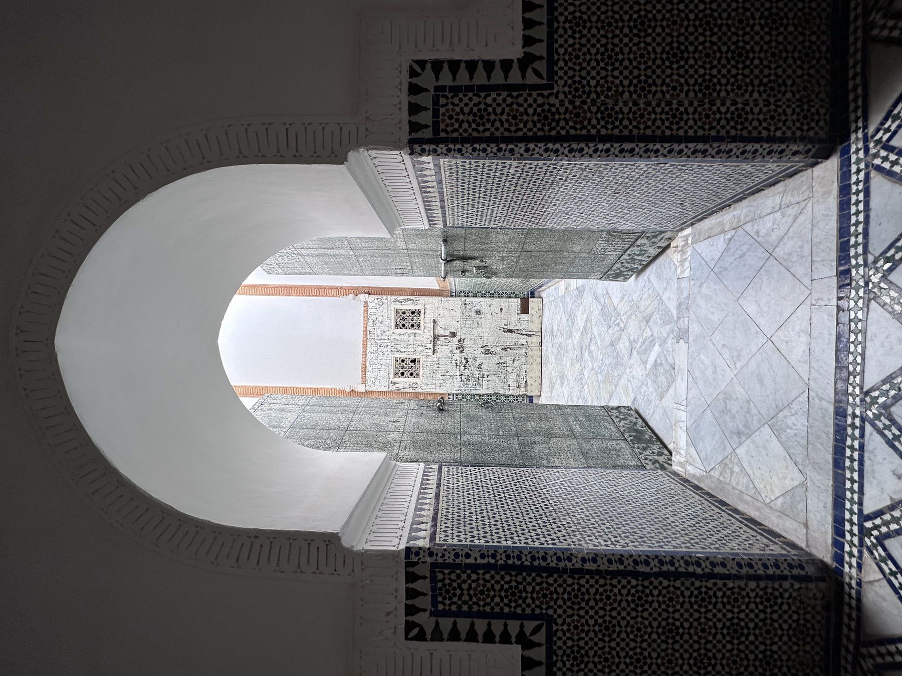 <p>Interior view through a pointed arch doorway</p>