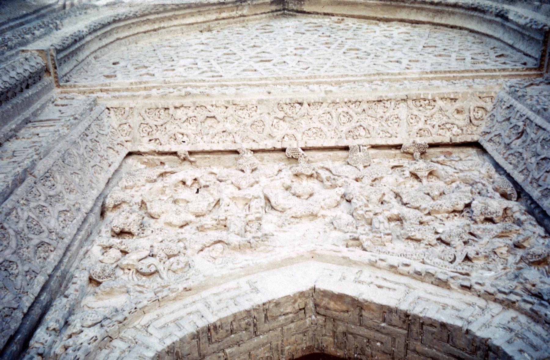 Exterior detail from entrance portal, showing carved stucco decoration