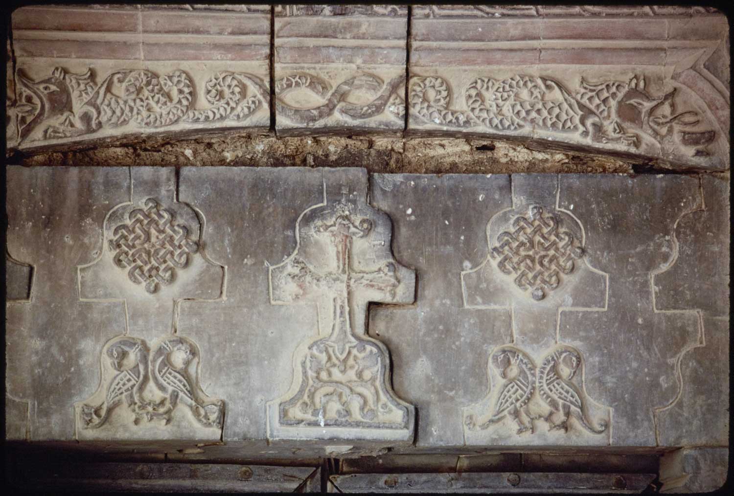 Monastic church, detail of lintel showing of southern exterior gate showing confronted birds, serpents and knotwork. 