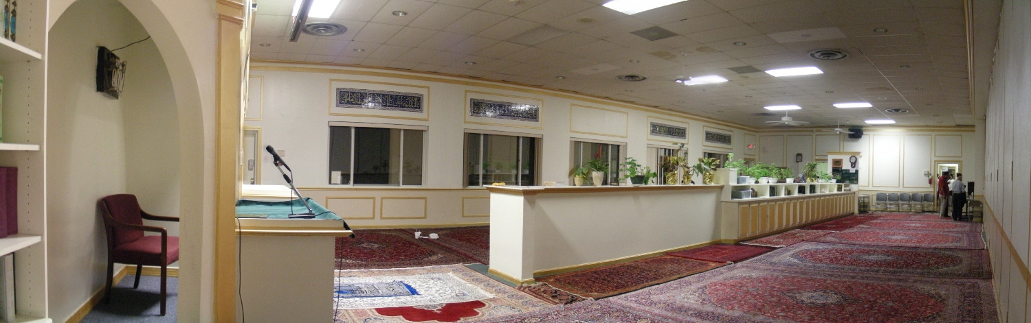 Panoramic view of prayer hall from the qibla wall; men's section in foreground