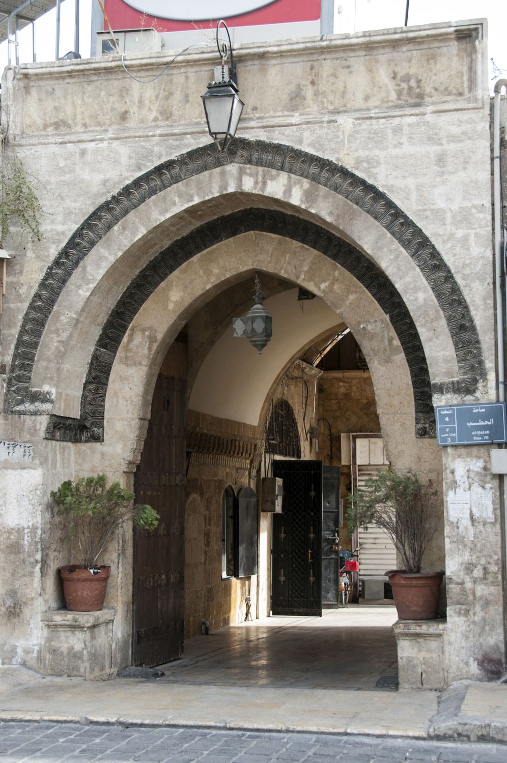 Arched entryway off square.