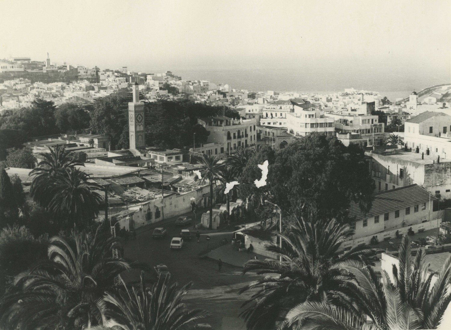 <p>View from above of Tangier toward the port. The minaret of Sidi Bou Abib slightly is to the left of the image center, the minaret of Jami' al-Jadid to the rear left of the image, and the Iglesia de la Purísima Concepción to the far right.</p>
