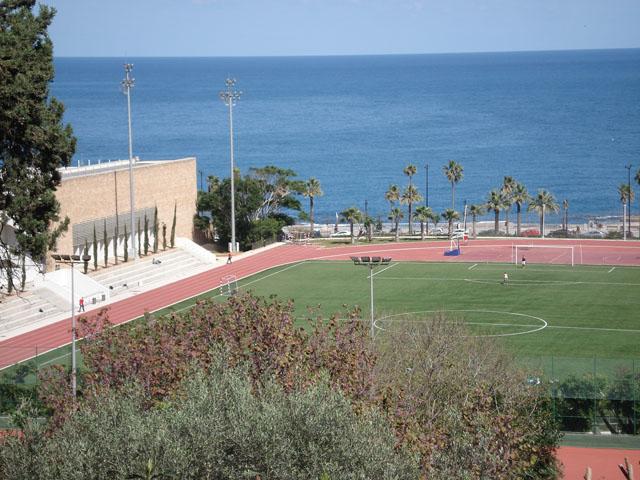 American University Campus - View on the Charles Hostler Student Centre, football playground  and the sea from the medium level of the campus