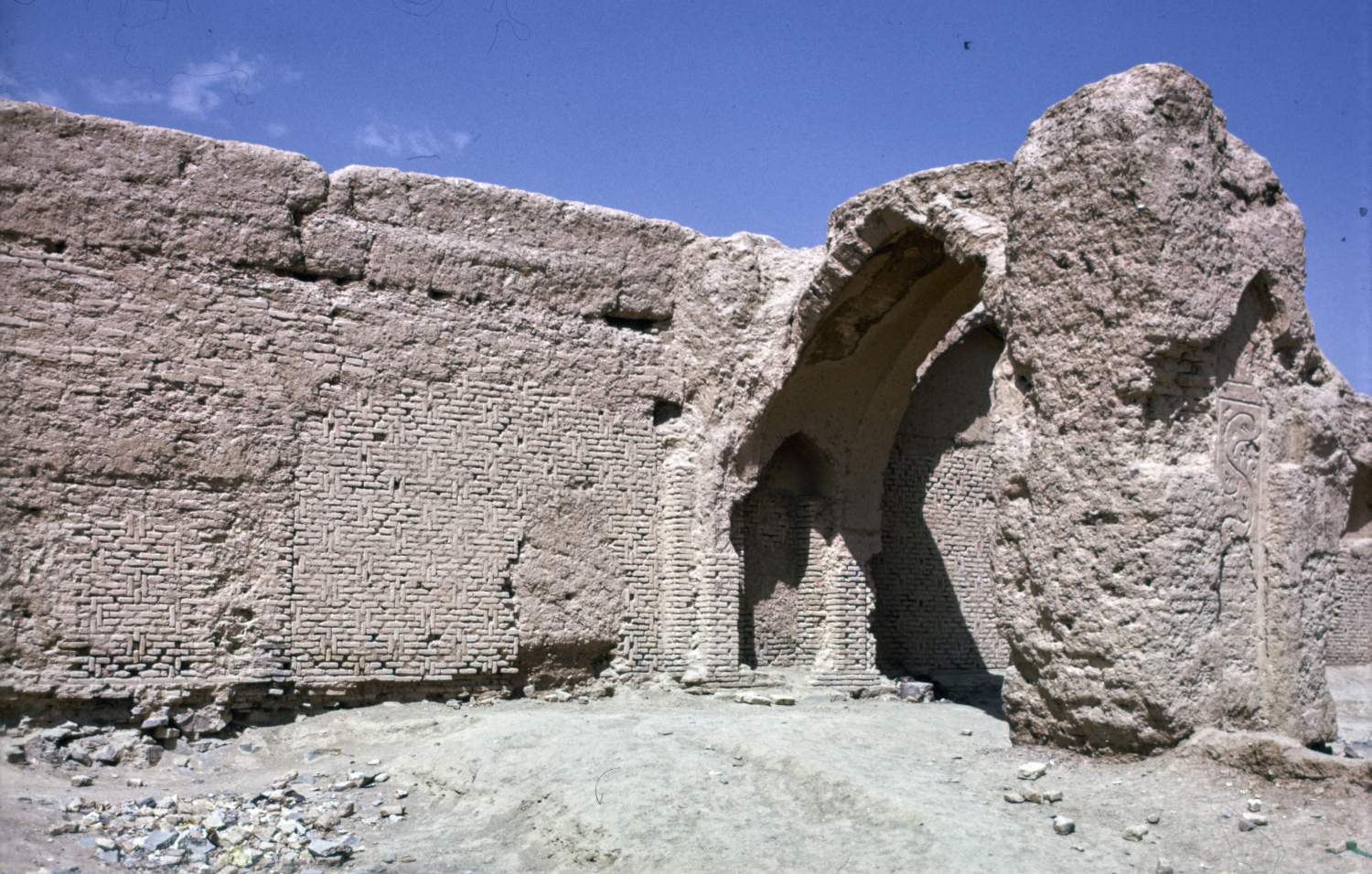 Remains of a pointed-arch vault against southwestern retaining wall (qibla wall), constructed later on top of piers from first phase.