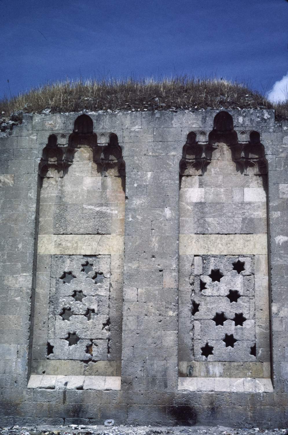 Turabt Bani Al-Shihna - <p>Aleppo. Bani al-Shihna mausoleum. Two windows with muqarnas hoods.</p>
