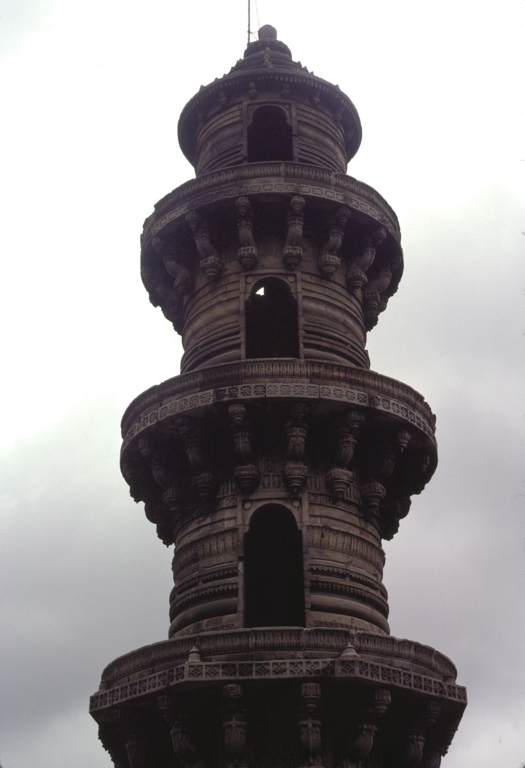 View of top part of north minaret, showing successive balconies formed by cornices.